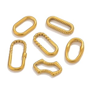 Detail of diverse oval stainless steel textured earring connectors for DIY jewelry making