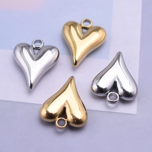 Set of four polished stainless steel irregular heart pendants in gold and silver colors