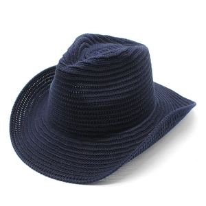 Close-up of navy blue crochet cowboy hat showing detailed woven fiber textures