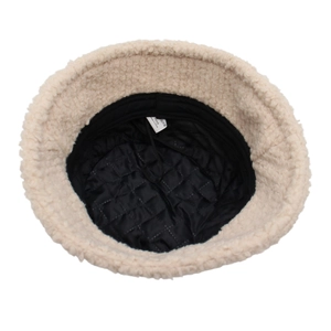 Plush faux fur bucket hat in beige with quilted lining and adjustable inner drawstring