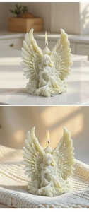 Detail of angel wing candle mold showing intricate 3D feathers and elegant sitting pose