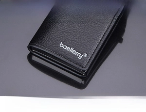 Close-up of litchi texture black leather wallet with baellerry logo and precise stitching