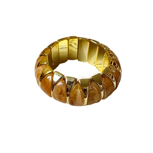 Vintage amber resin and gold metal elastic bangle bracelet with a geometric rhombus design