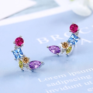 Fashionable multicolor zircon cluster stud earrings on elegant light blue background