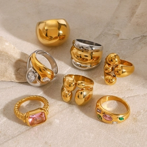 Exaggerated stainless steel zircon rings with irregular shapes on marble surface