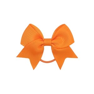 Detail of bright orange grosgrain ribbon bow hair tie with textured ribbed fabric