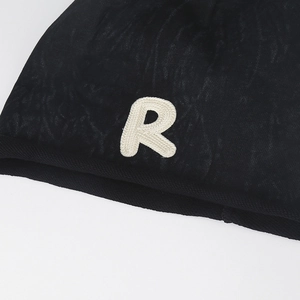 Black knitted beanie with contrast R embroidery and textured rolled edge for winter