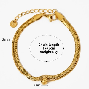 Detail of golden stainless steel snake chain bracelet with 6mm bead and adjustable tail