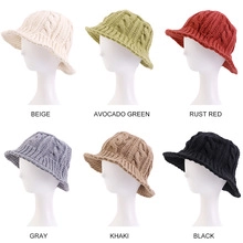 Multiple color display of knitted beret hats with braided texture on mannequins