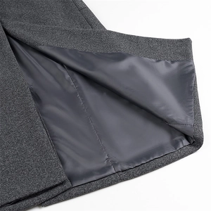Detailed view of dark grey wool coat showing smooth lining and premium fabric texture