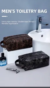 Close-up of dual-layer PU leather toiletry bags in brown and black for travel