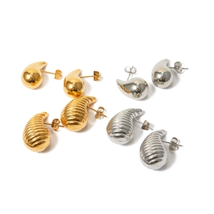 Minimalist teardrop earrings in 18k gold and silver finishes with striped and smooth textures