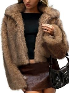 Close-up of fluffy brown faux fur jacket texture with long sleeves and wide lapels