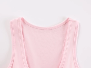 Close-up of pink knit sports tank top neckline showing high-quality stitching and fabric