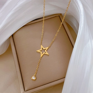 Minimalist gold star tassel necklace with hollow star pendant and sparkling zircon stone