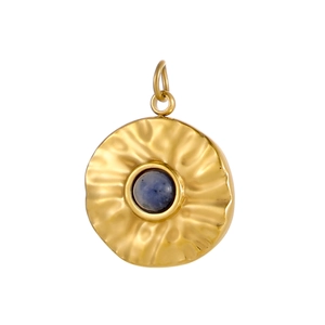 Detail of a vintage hammered gold pendant featuring a central round blue natural stone