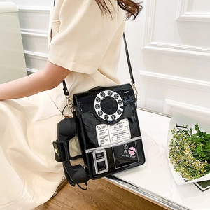 Retro black patent leather telephone-shaped crossbody bag with dial detail and handset