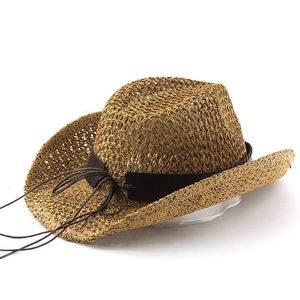 Detailed macro view of breathable woven straw texture and leather strap on cowboy hat