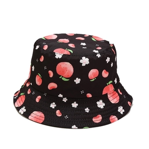 Reversible bucket hat with peach and floral print for sun protection in summer
