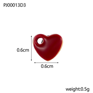 Macro view of 0.6cm red enamel heart pendant with dimensions and 0.5g weight info