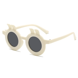 Fashionable cream beige round children's sunglasses with cute bunny ears on white background