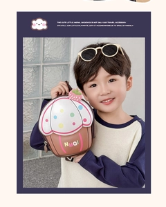 Toddler backpack featuring a 3D cupcake shape with colorful polka dots and strawberry detail