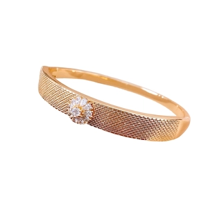 18K gold plated bangle featuring a floral buckle and elegant woven metal texture design