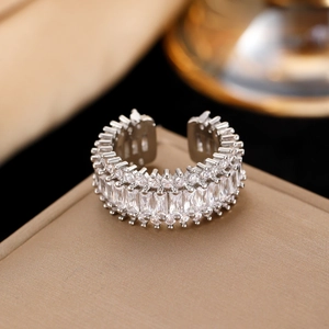 Macro detail of luxury silver open ring with pavé-set cubic zirconia crystals