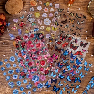 Floral butterfly PET stickers set for scrapbooking on vintage dark wood background