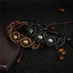 Handmade retro braided bracelets with adjustable drawstrings and metallic beads for unisex