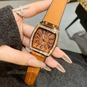 Elegant rose gold rectangular watch with diamond bezel and brown leather strap on wrist
