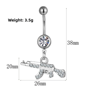 Macro view of AK rifle shape belly piercing with white rhinestones and size guide