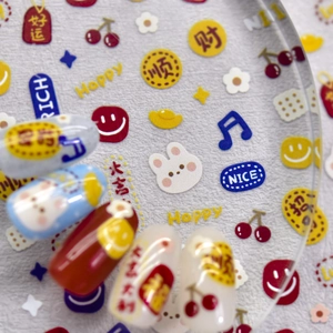 Macro shot of embossed nail art stickers with cute rabbit, cherry and lucky patterns