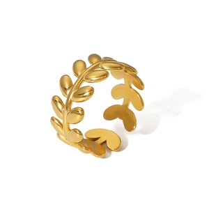 Detailed view of a gold leaf-shaped open ring made of polished stainless steel