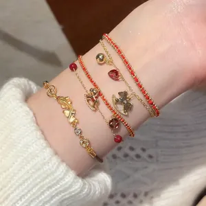 Elegant gold-plated horse pearl charm bracelet set with red woven cord and zircon