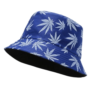 Detail view of the navy canvas bucket hat with white leaf print and black lining