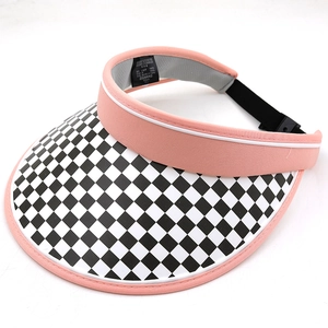 Pink sun visor hat with checkerboard pattern brim and adjustable strap for women