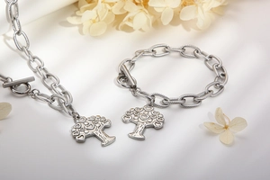 Silver tree of life jewelry set featuring chunky chain necklace and bracelet with T-bar closure
