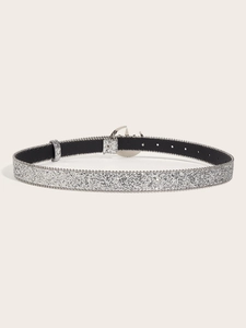 Silver glitter belt with G-shaped metal buckle displayed in a circular flat lay arrangement