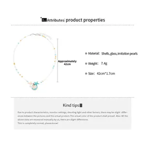 Detail of beach style necklace featuring shell, starfish pendant and pearl beads