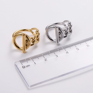 Gold and silver OT buckle chain rings shown with a ruler for precise size measurement