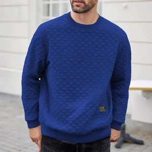 Men's blue long sleeve crewneck sweatshirt featuring unique textured checkerboard knit