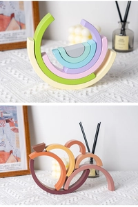 Detail of multi-colored wooden rainbow blocks showing smooth texture and stacking design