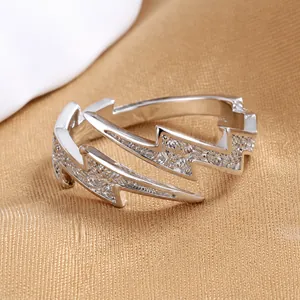 Detailed close-up of a stylish S925 silver lightning bolt ring with sparkling pavé stones.