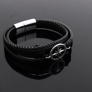 Handwoven black leather men's bracelet featuring a silver star compass magnetic clasp