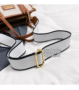 Detail of the high-quality gold hardware buckle and stylish contrast webbing strap