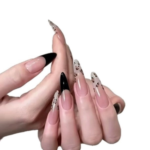 Long almond press-on nails featuring a French tip design with vintage leopard patterns