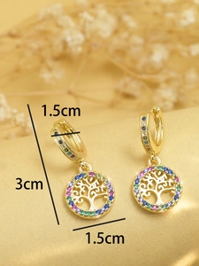 Close-up of golden tree of life drop earrings with colorful zircon and size markers