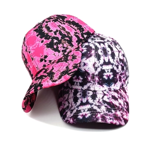 Stylish tie-dye baseball caps in pink and purple patterns for a trendy summer look
