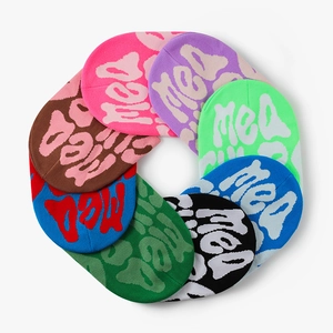 Top view of colorful Y2K acrylic knitted beanies featuring artistic jacquard lettering